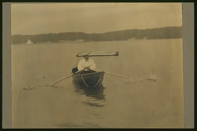 [Theodore Roosevelt, seated in rowboat, rowing]