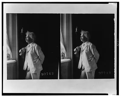 [Mark Twain (Samuel Langhorne Clemens), three-quarter length portrait, standing by window, facing left]