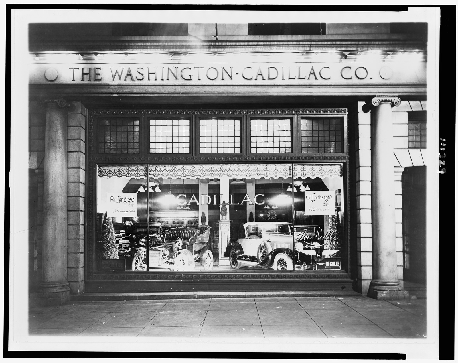 [Automobiles in window of the Washington-Cadillac Co., Washington, D.C.], [1927] — historic photograph