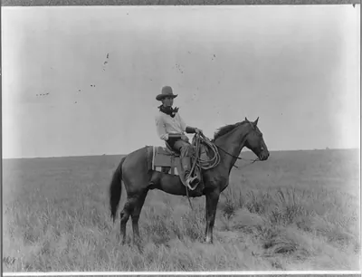 [Erwin E. Smith, full-length portrait, facing right, on horseback]
