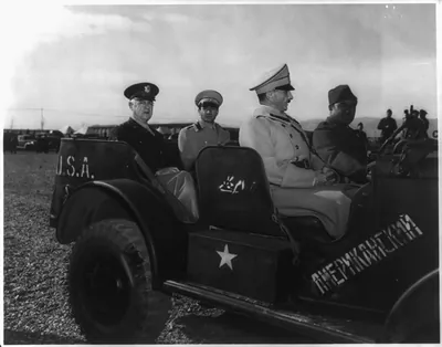 Reza Pahlevi, Shah of Iran, with Maj. Gen. Connolly in reconnaissance car during inspection of U.S. Army Persian Gulf Command troops