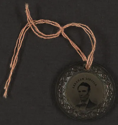 Abraham Lincoln tintype portrait medallion tied with string