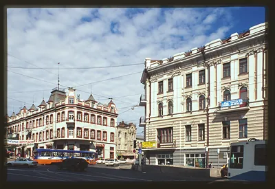 City street with trams and historic corner buildings