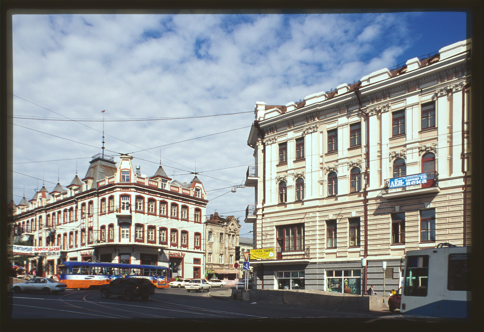 City street with trams and historic corner buildings — historic image