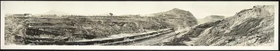 Panoramic photograph of a terraced excavation cut