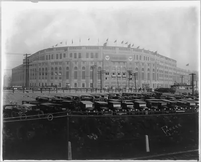 [Yankee Stadium, Bronx, New York City; with automobiles parked in foregrd.]