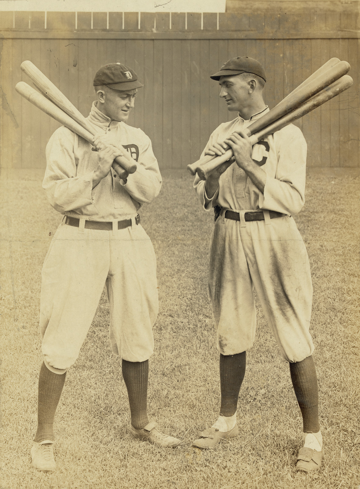 [Ty Cobb, Detroit, and Joe Jackson, Cleveland, standing alongside each other, each holding bats], c1913. — historic photograph