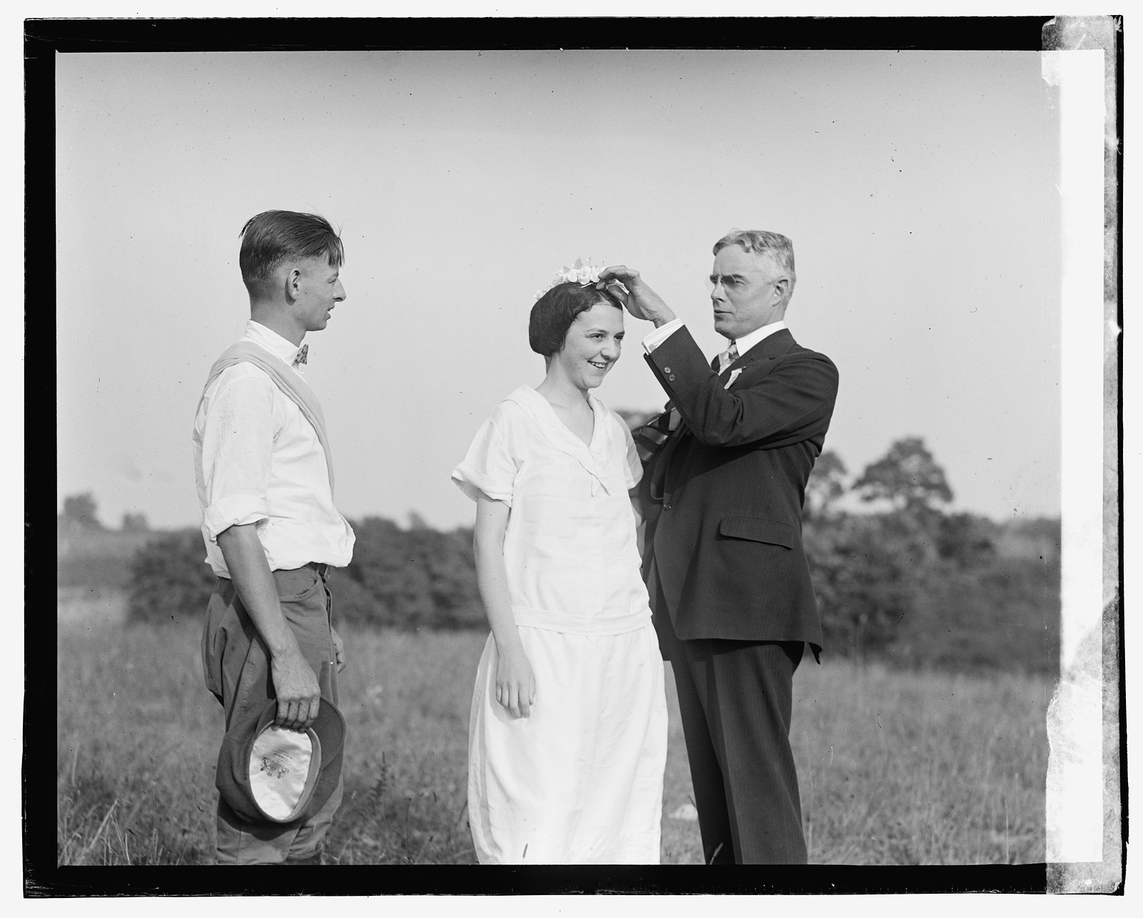 [Unidentified men and woman in field], [1923] — historic photograph