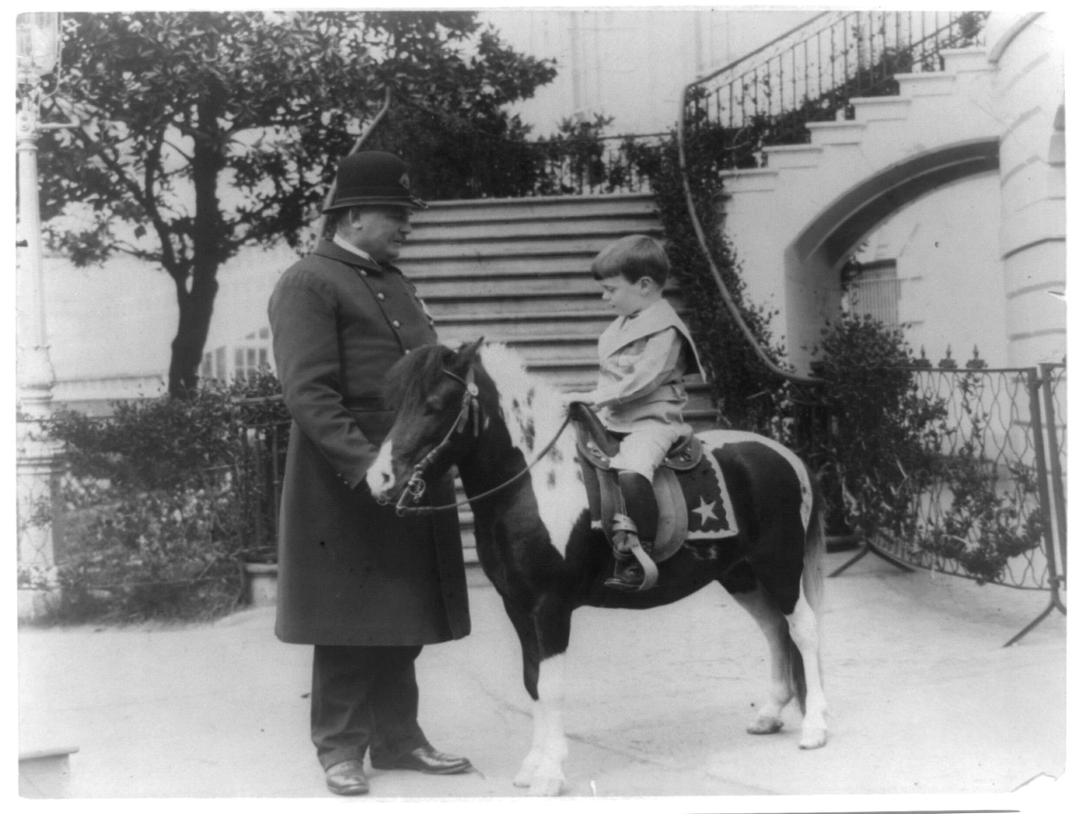 [Quentin Roosevelt on pony beside White House policeman], 1905 — historic photograph