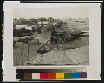 [Entry point of the New River into the United States at Calexico and Mexicali, view toward west]