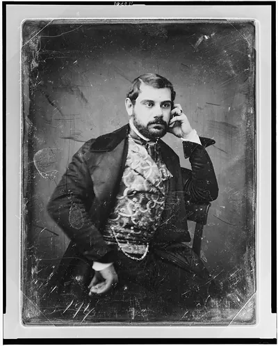 [Sesto Benedetti, three-quarter length portrait, facing three-quarters to right, with beard, sitting in chair, wearing large ring and figured waistcoat]