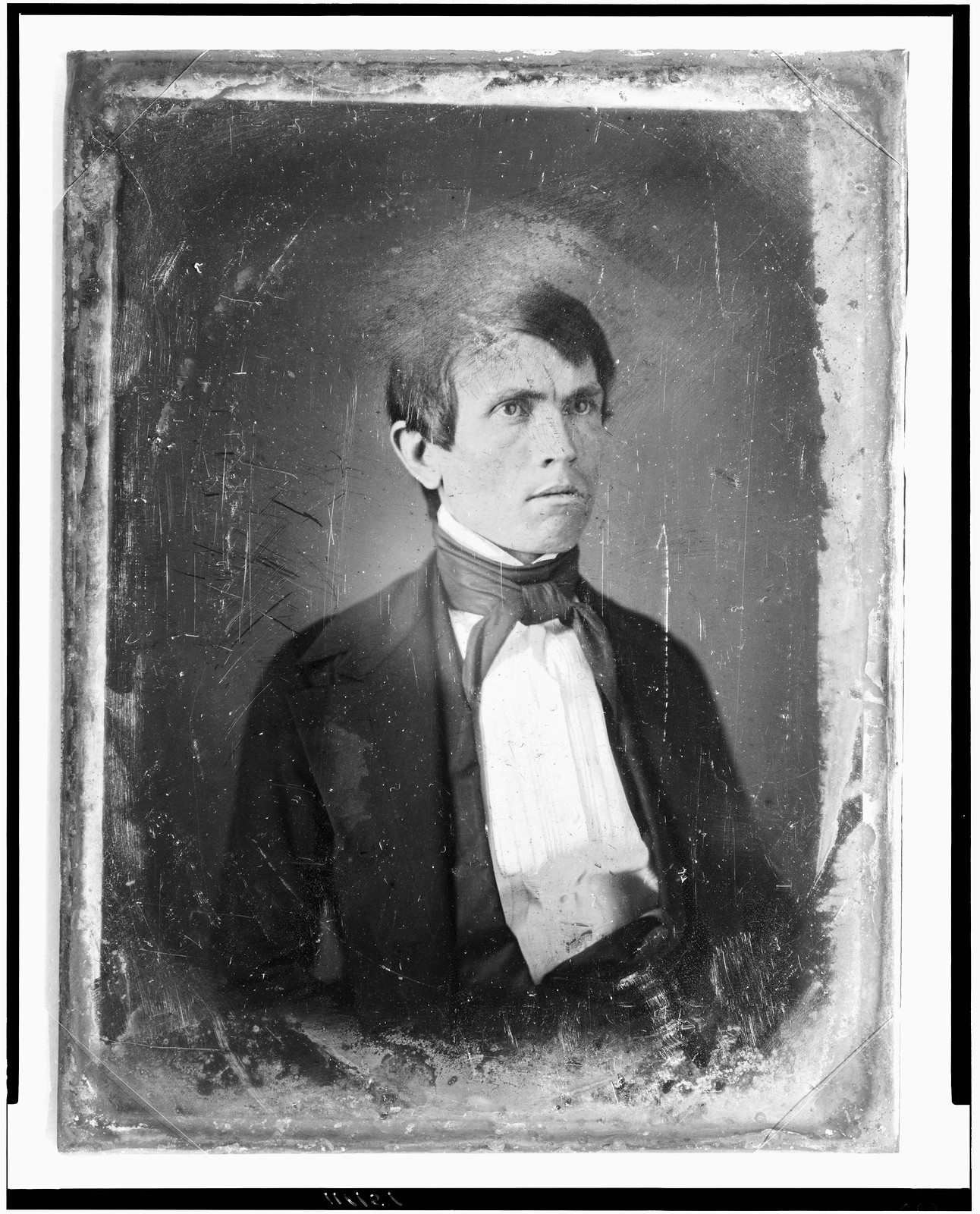 Daguerreotype portrait of a man in dark jacket and cravat, 1844 — historic photograph