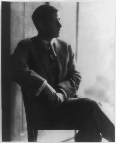 [Clarence White in suit, seated]