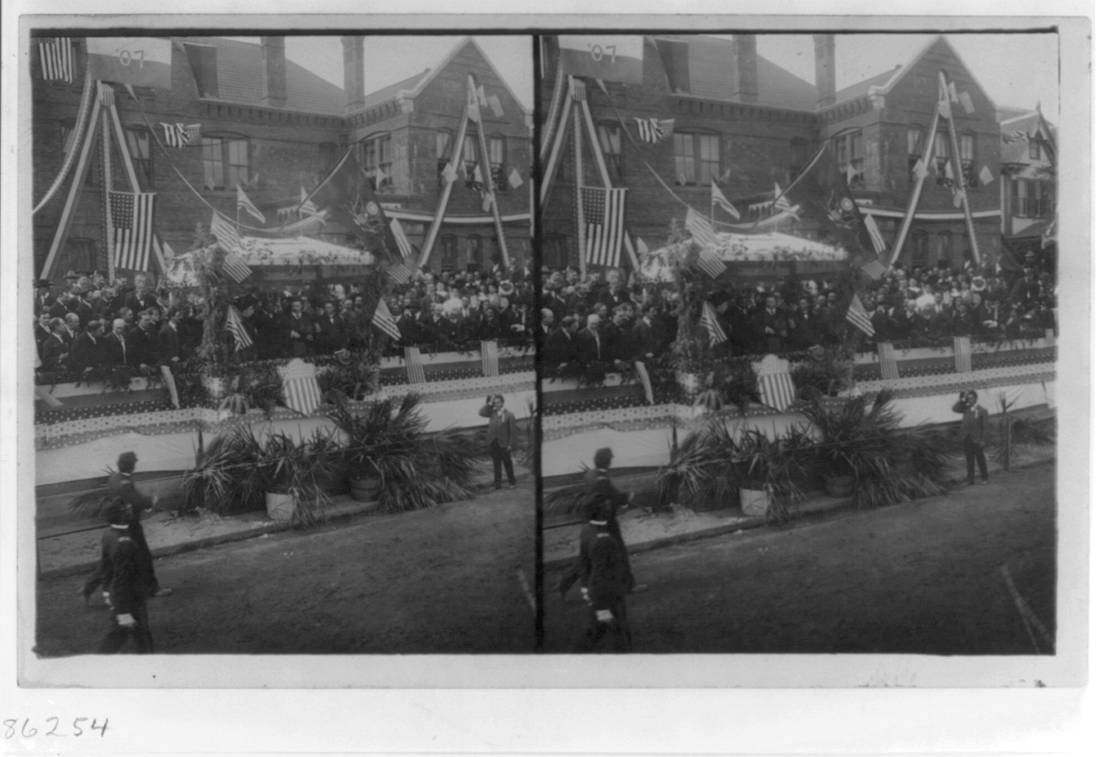 [Theodore Roosevelt and crowd on decorated rostrum], c1905. — historic photograph