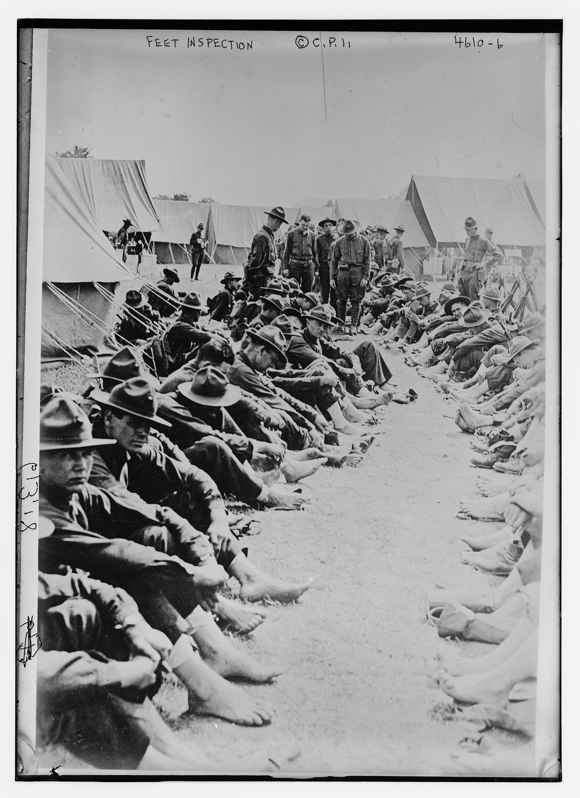 Feet inspection, n/a — historic photograph