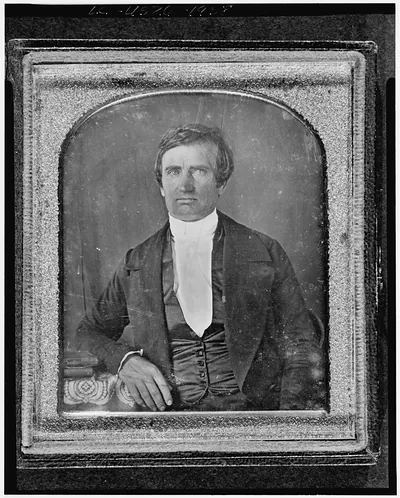 [Nathaniel Green, half-length portrait, facing front, seated with arm on table with tablecloth]