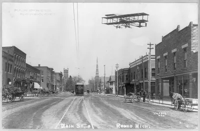 [Mich. - Romeo - Main Street, showing trolley and airplane]