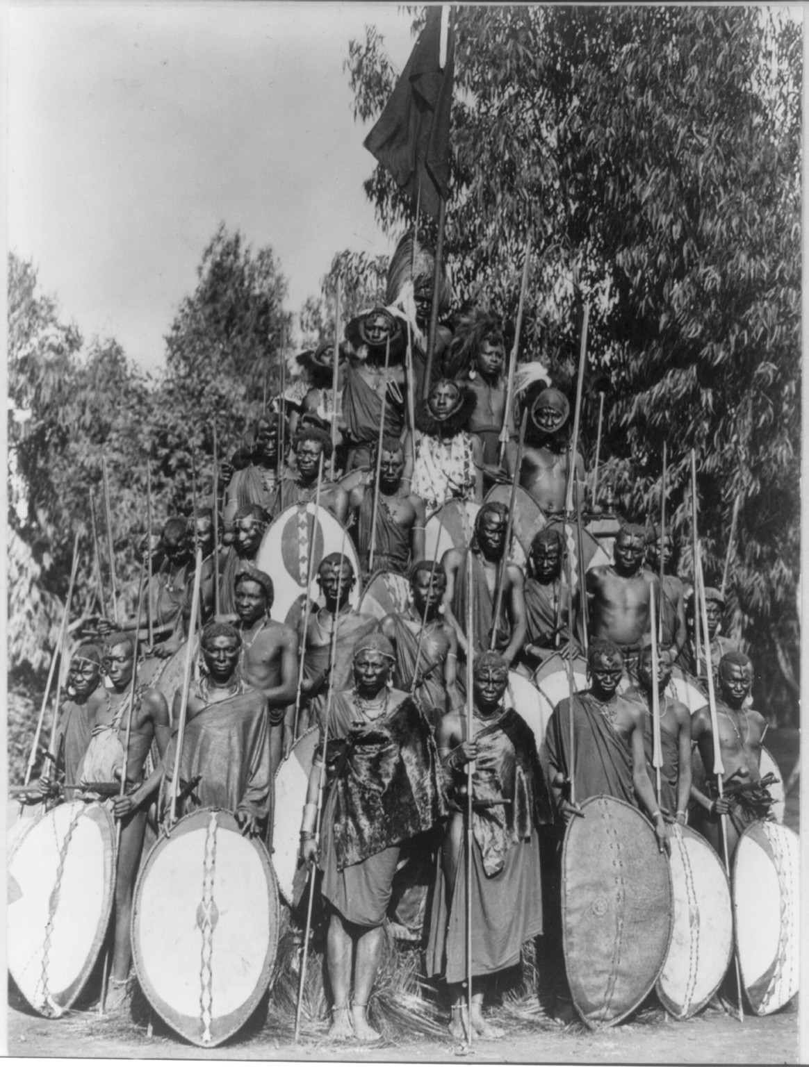 [Africa. Group of Kavirondo natives posed in standing pyramid with spears and shields. ca. 191-.], [between 1910 and 1920] — historic photograph