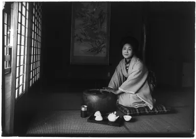 [A Japanese lady kneeling in her home]