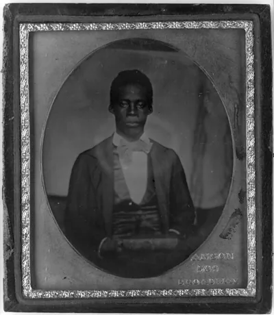 [Edward Wilmot Blyden, half-length portrait, facing front, holding book]