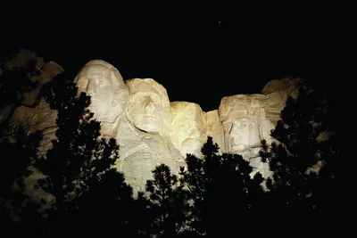 Mount Rushmore carved faces lit at night