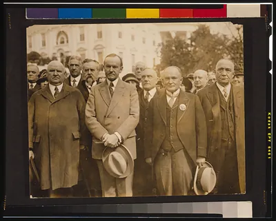[President Coolidge with an international delegation from the Scottish Rite of Freemasonry, including John Henry Cowles, the Sovereign Grand Commander, to the President's right]