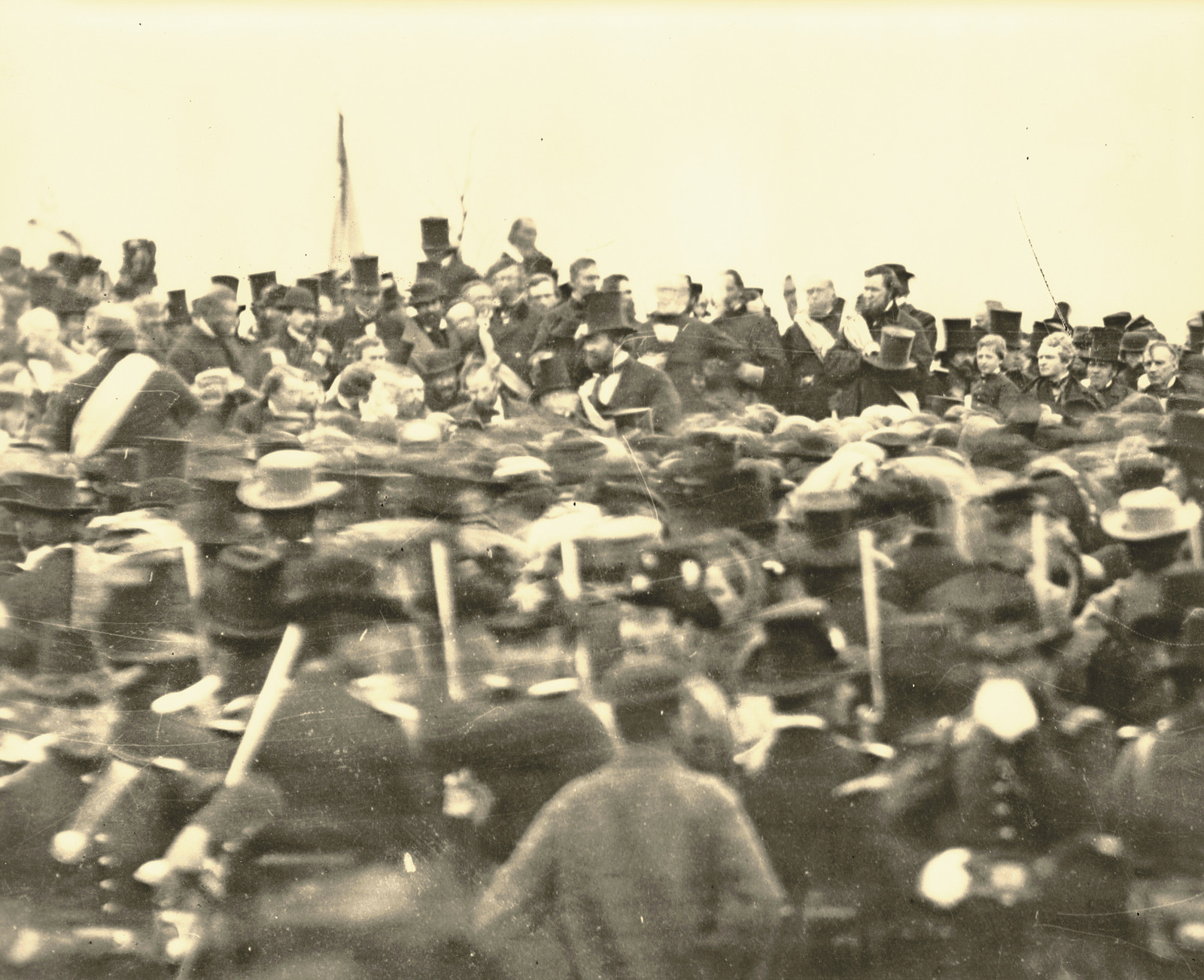Large crowd of men in top hats and soldiers, sepia photograph — historic photograph