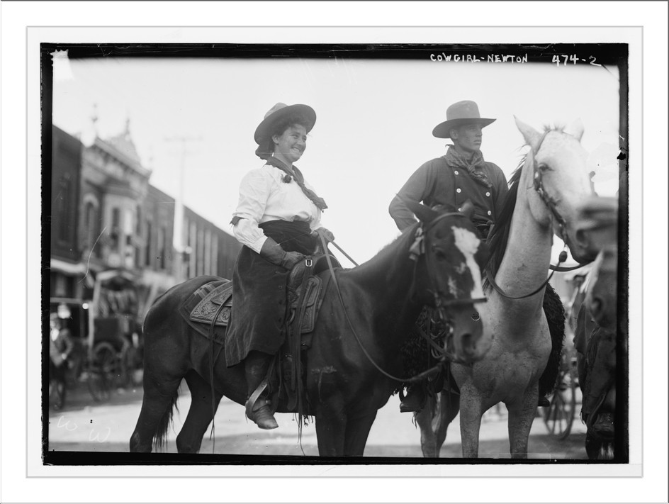 Cowgirl and cowboy on horseback, Newton, Kansas, 1908 — historic photograph