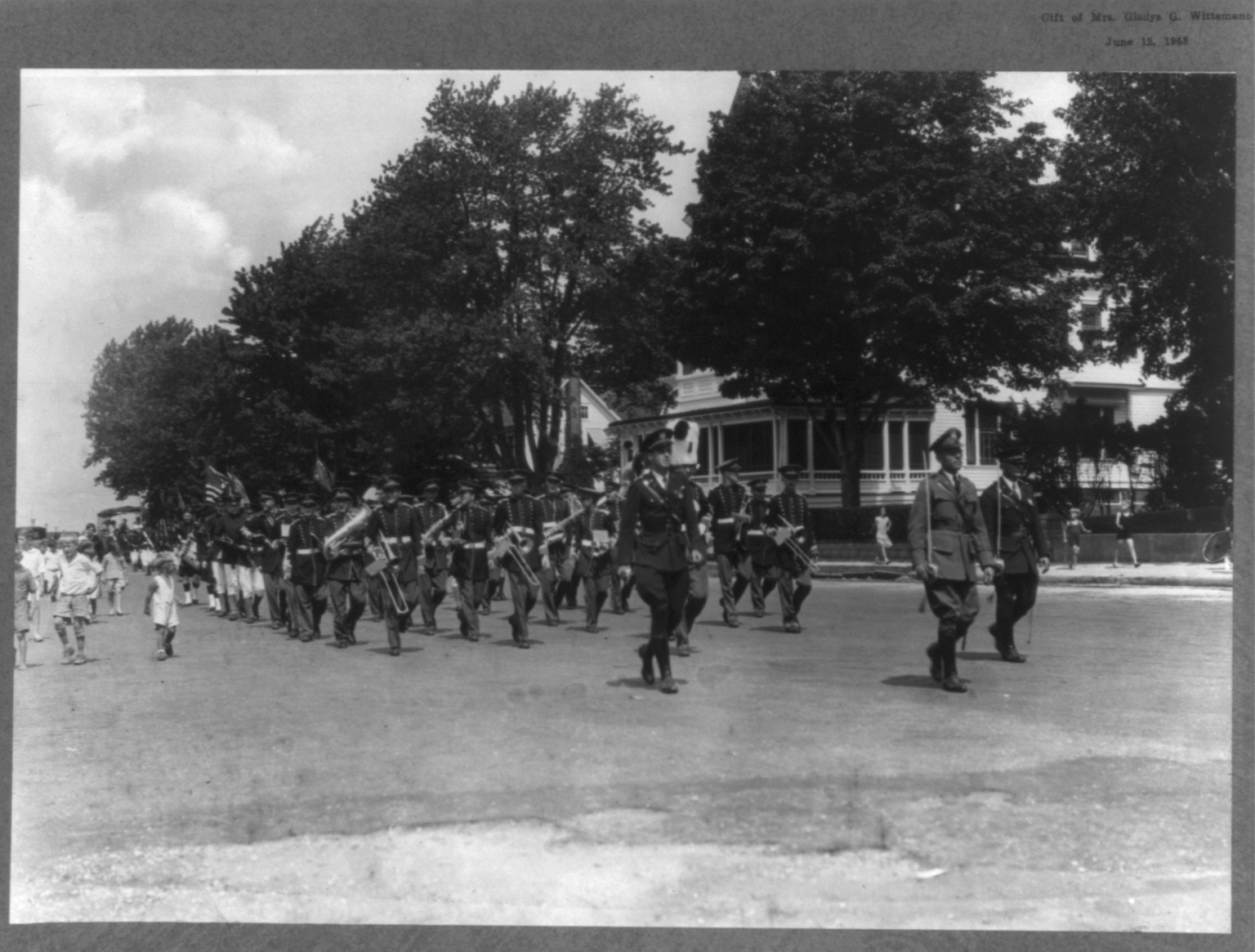 New Jersey - Island Heights. [View from front of] Band (men in uniform) marching with children watching — historic photograph