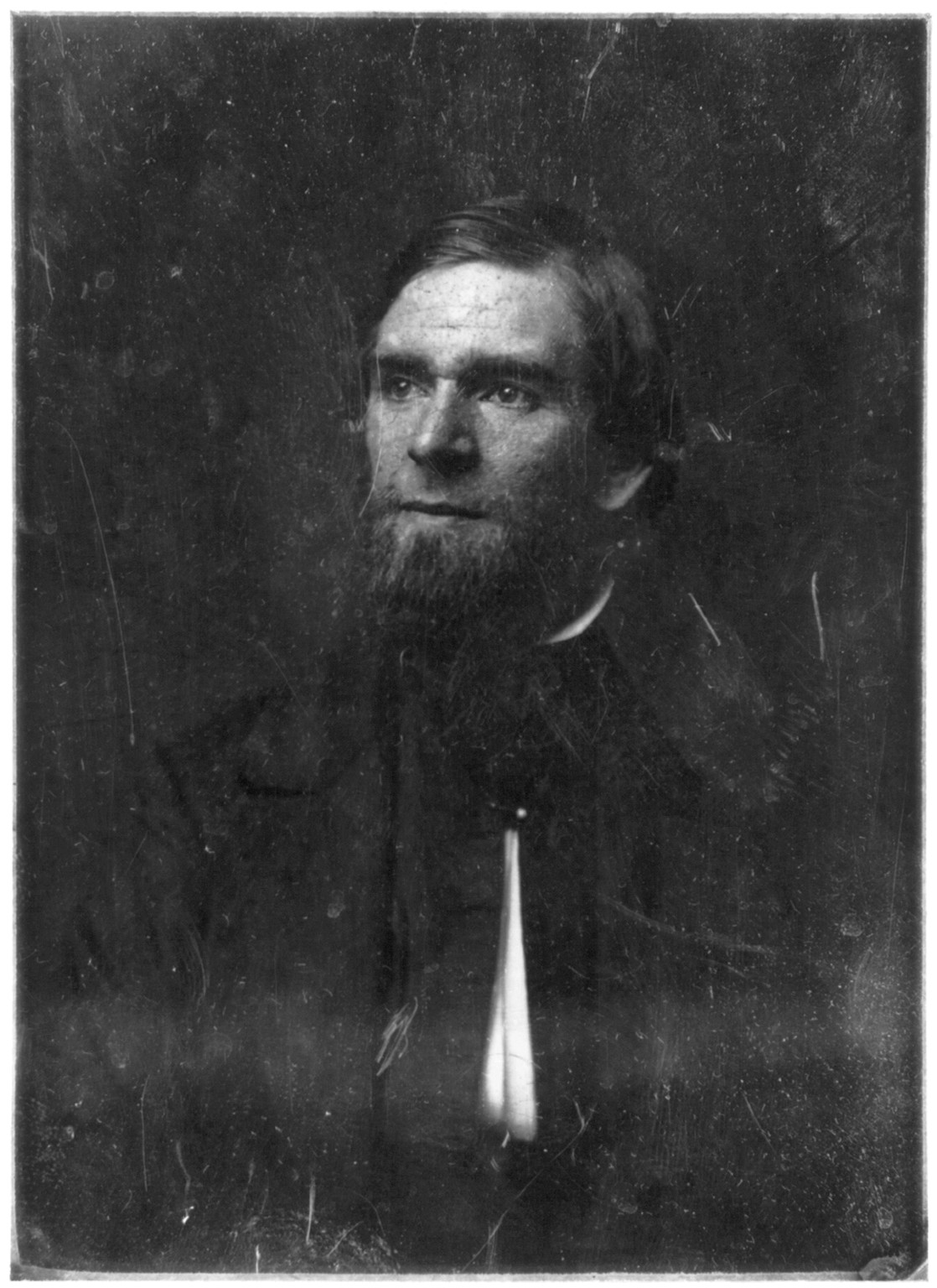 Bearded man in dark early portrait photograph, 1844 — historic photograph