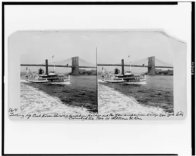 Looking up East River showing Brooklyn Bridge and the new suspension bridge, New York