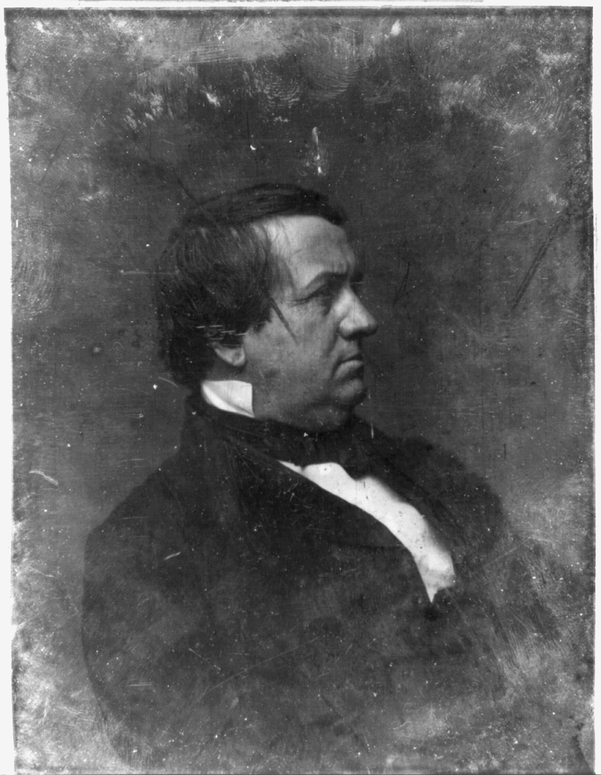 Profile portrait of a man in dark coat and cravat, 1844 — historic photograph