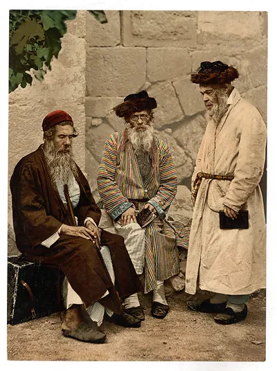 Three bearded men in traditional dress, hand-colored photograph