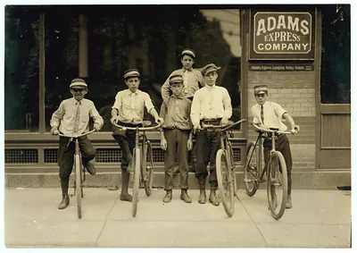 Messenger boys with bicycles outside Adams Express Company