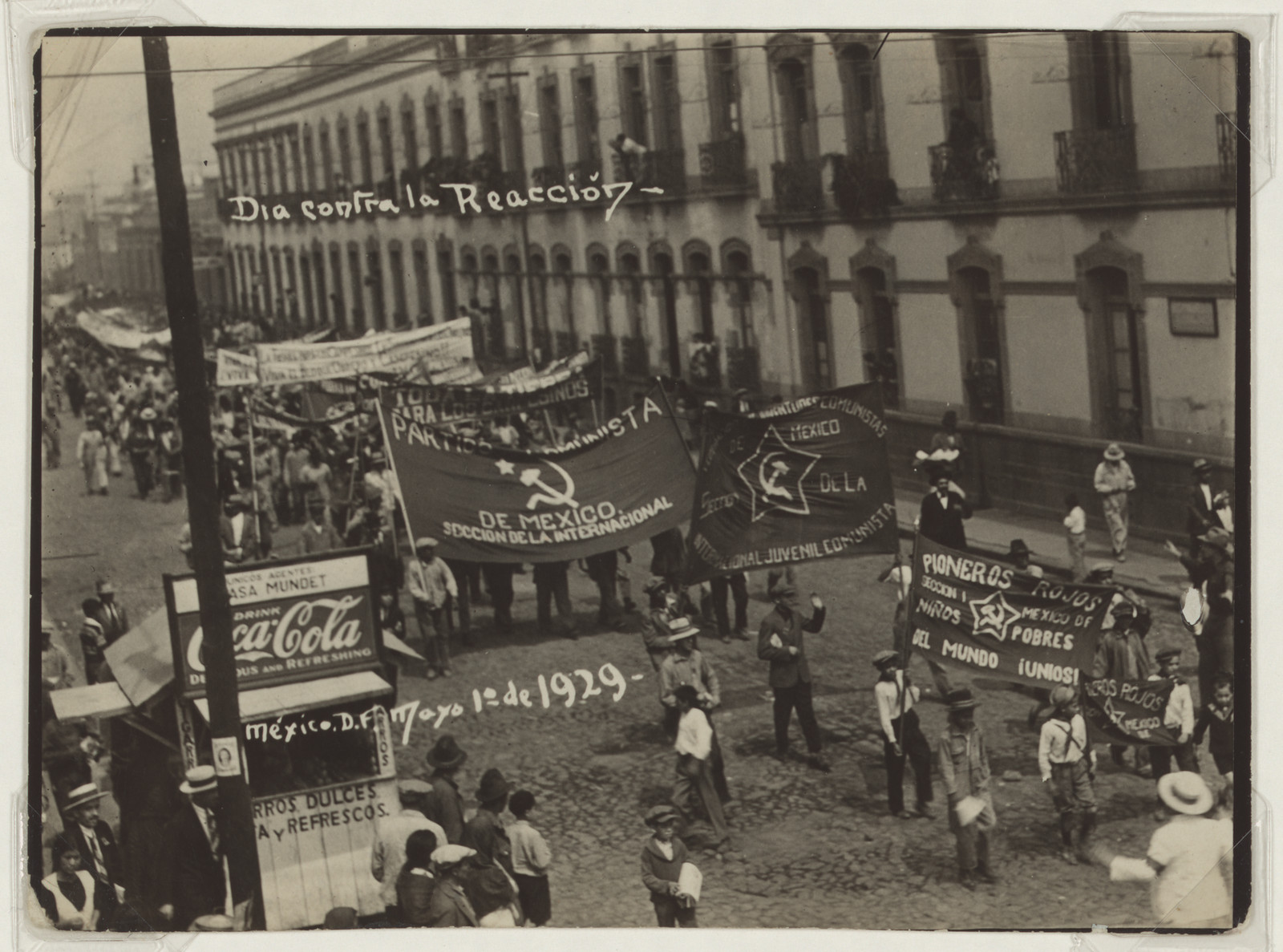 Procession banners reading "Día contra la reacción", Mexico City, 1929 — historic image