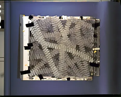 Wavy patterned design on a taped framed sheet