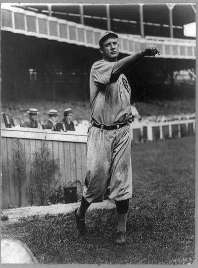 [Orval Overall, baseball player for Chicago Cubs, throwing baseball in front of grandstand]
