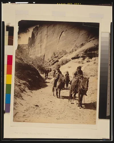 Band of mounted Navahos passing through Cañon