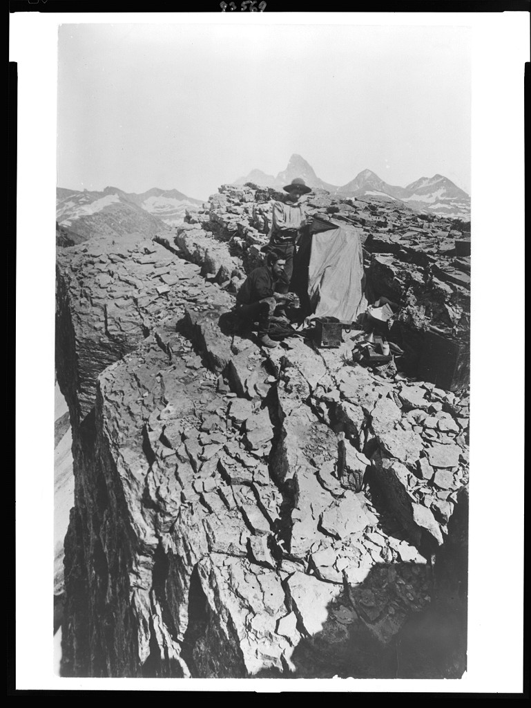 [William Henry Jackson and another man with photographic equipment on mountain in Yellowstone Park, Wyoming, 1871-1878], [between 1871 and 1878] — historic photograph