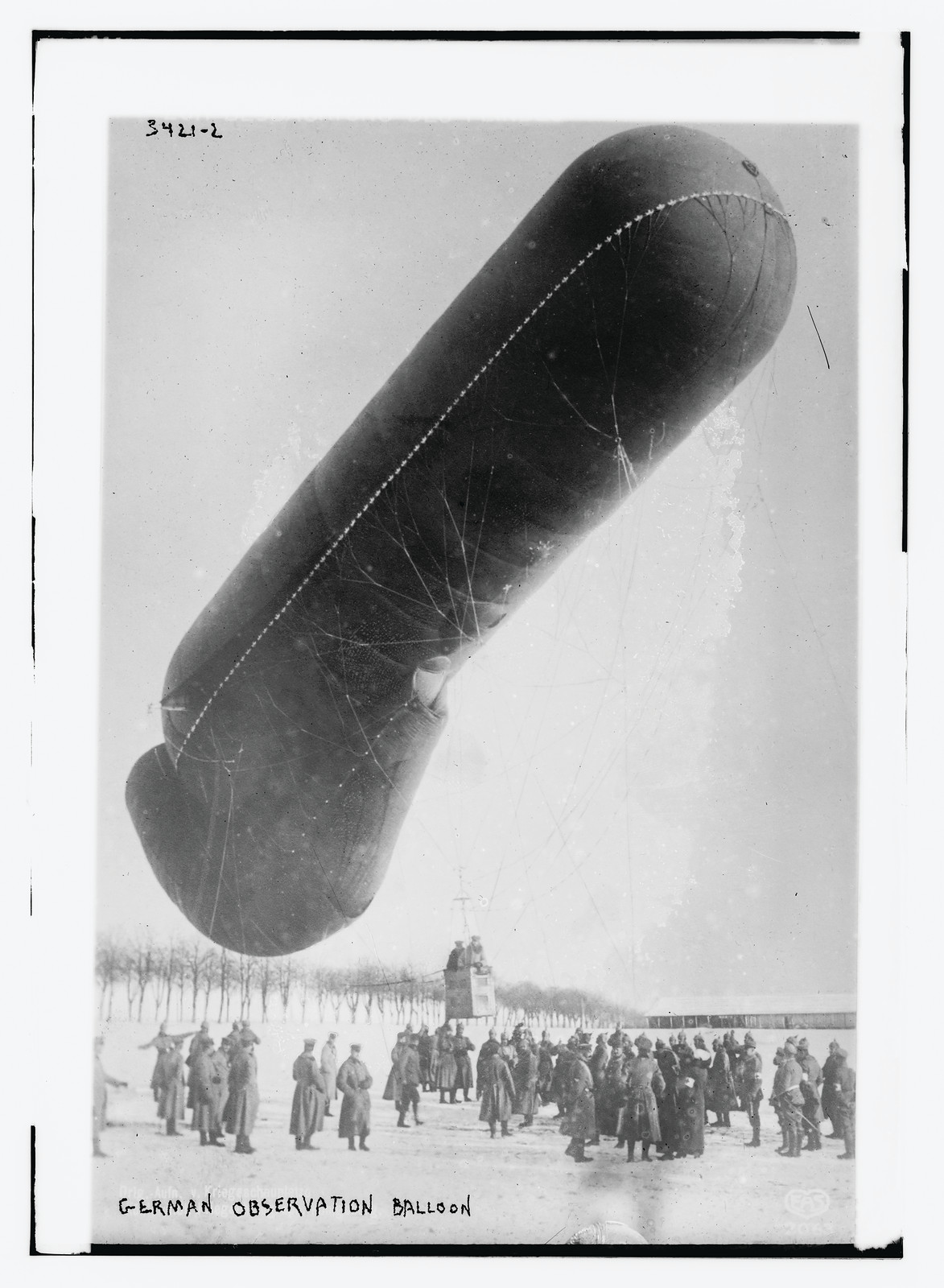 German Observation balloon in snow, w/ soldiers, n/a — historic photograph