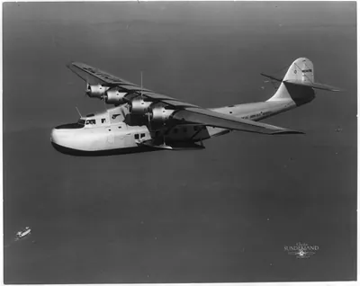 Extreme closeup of Philippine Martin Clipper in flight over San Francisco Bay - Capt. Musick at controls