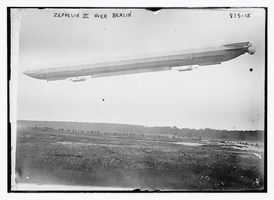 Zeppelin III in flight over field, Berlin