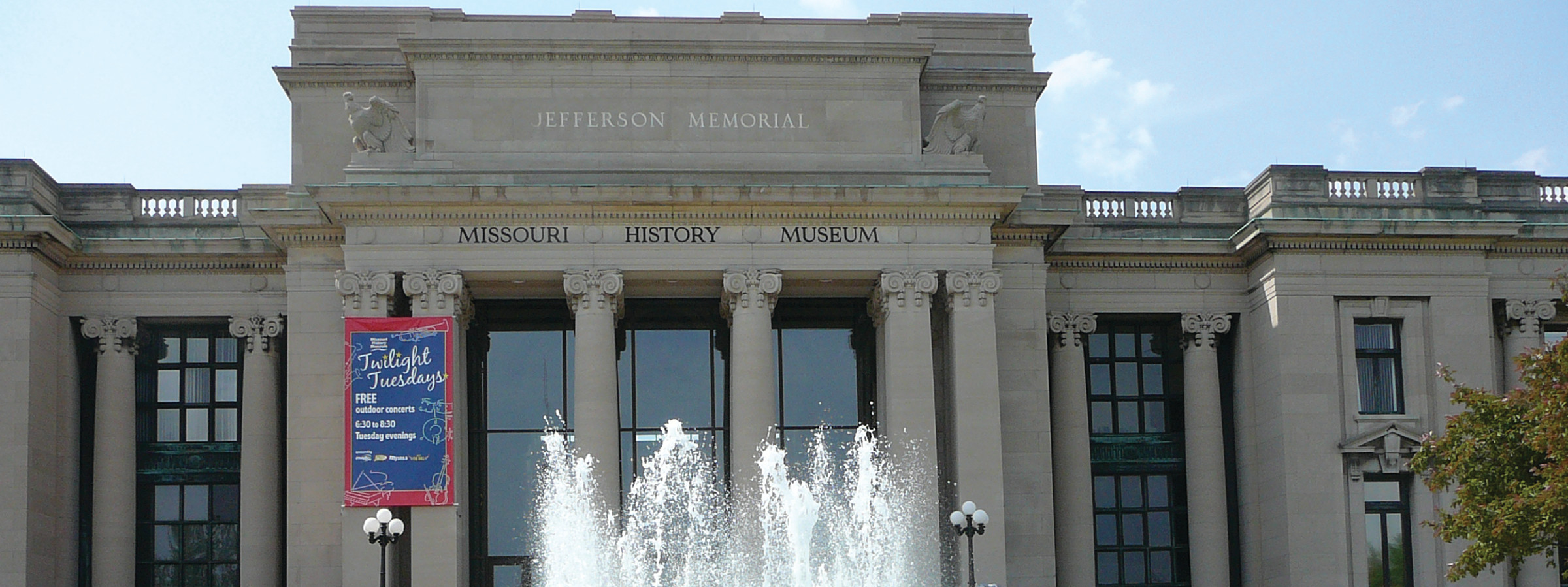 Missouri History Museum facade with fountain and Twilight Tuesdays banner — historic image