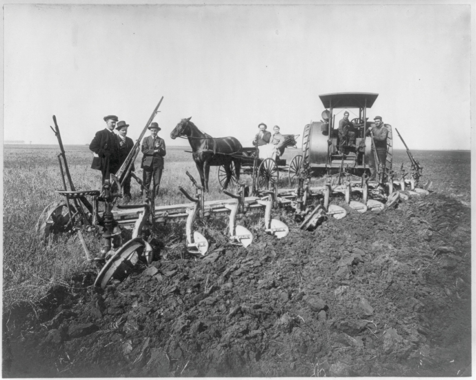 Plowing with gasoline tractor pulling 12-16 inch plows on John B. Siemer Farm, Harmony Township, Casselton, N.D., [no date recorded on caption card] — historic photograph