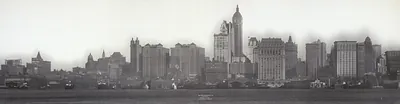 Panoramic black-and-white view of Manhattan skyline across water