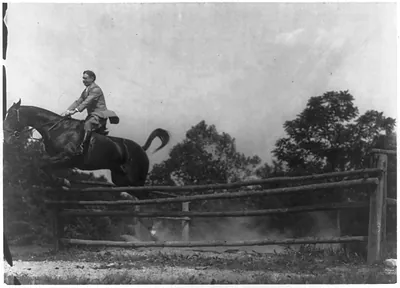 Mr. Upson on horse making jump