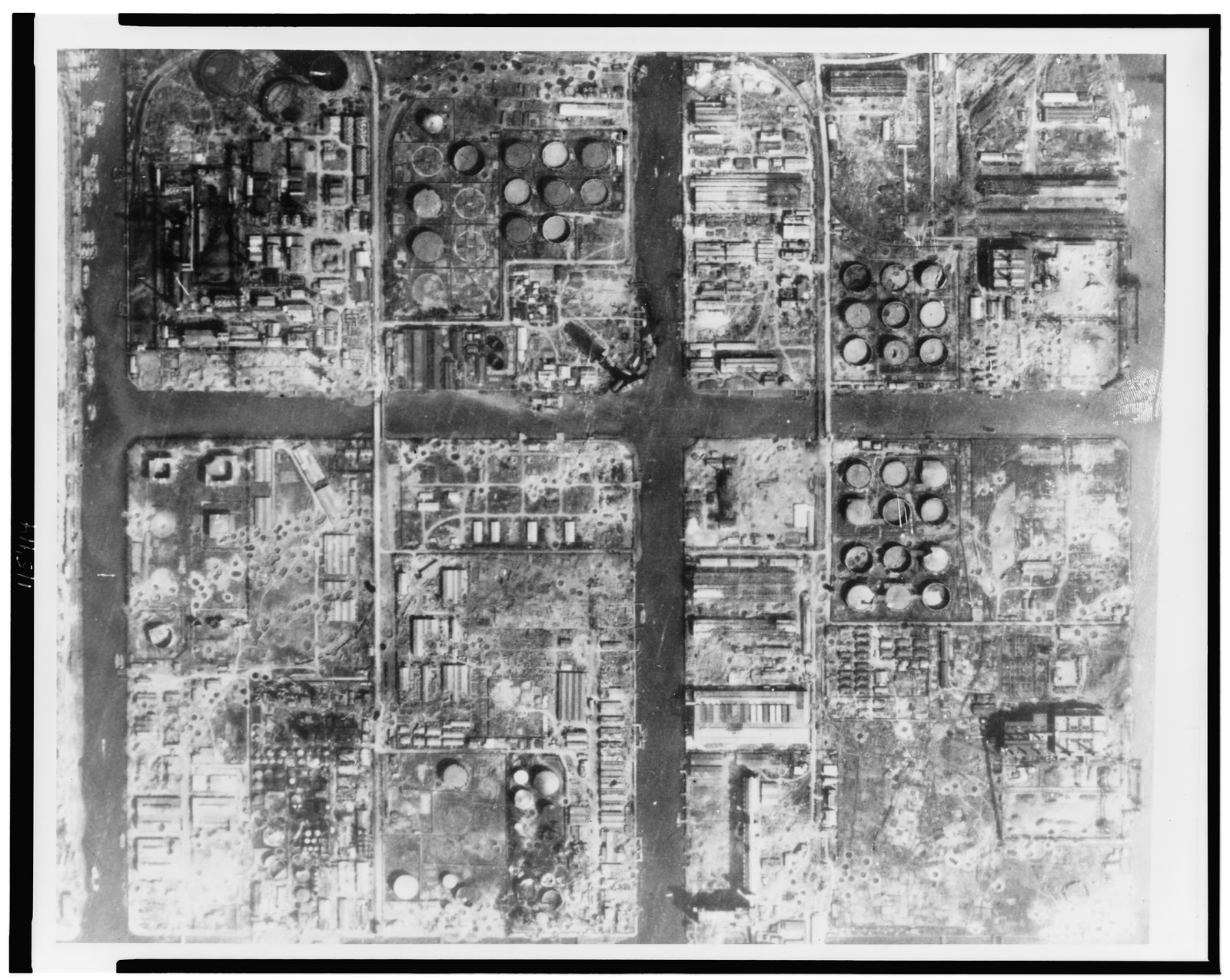 [Aerial view of Kawasaki Petroleum Center, Akashi, Japan, after bombing], [1945] — historic photograph