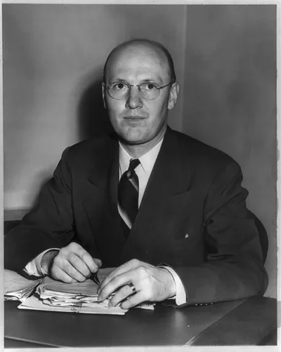 [Charles Franklin Brannan, Secretary of Agriculture, half-length portrait, seated at desk, facing left]