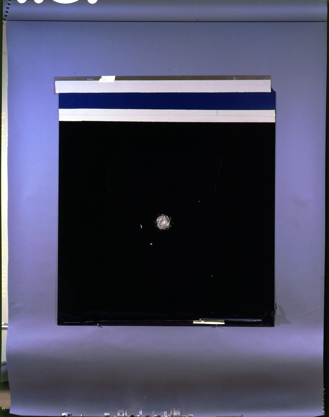 Spiral galaxy photograph on a black background — historic photograph