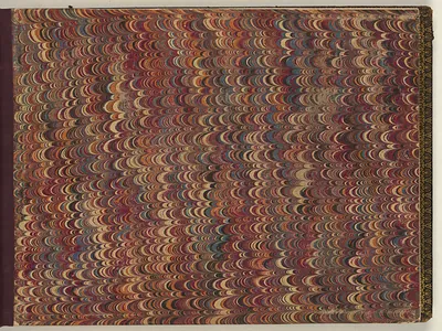 Marbled paper with repeating crescent pattern in red and cream